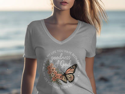 Gray V-neck t-shirt with floral and butterfly design and text.