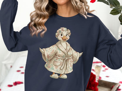 Woman wearing a navy sweatshirt with a duck character in a robe and curlers.