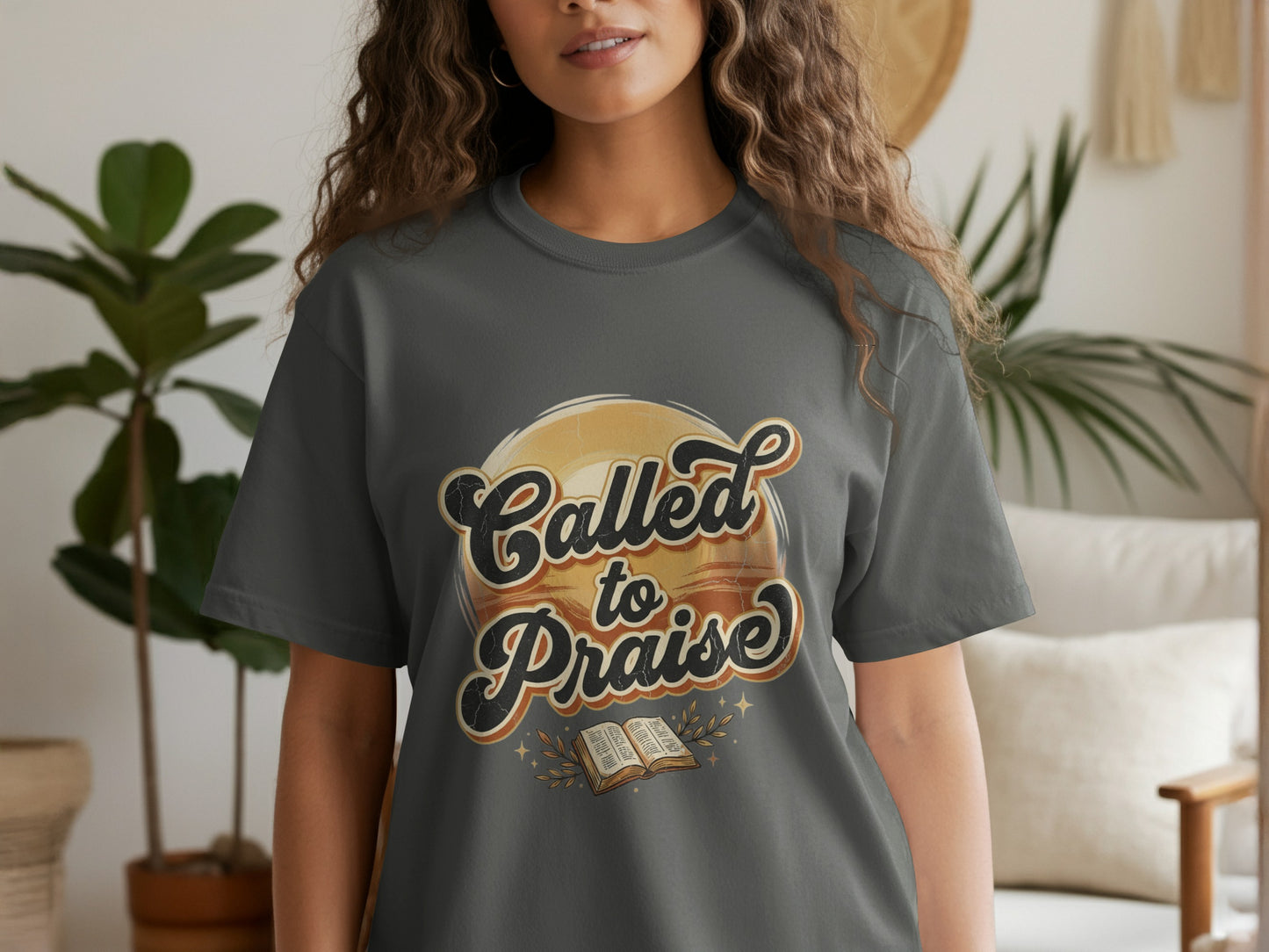 T-shirt with "Called to Praise" text and open book graphic.