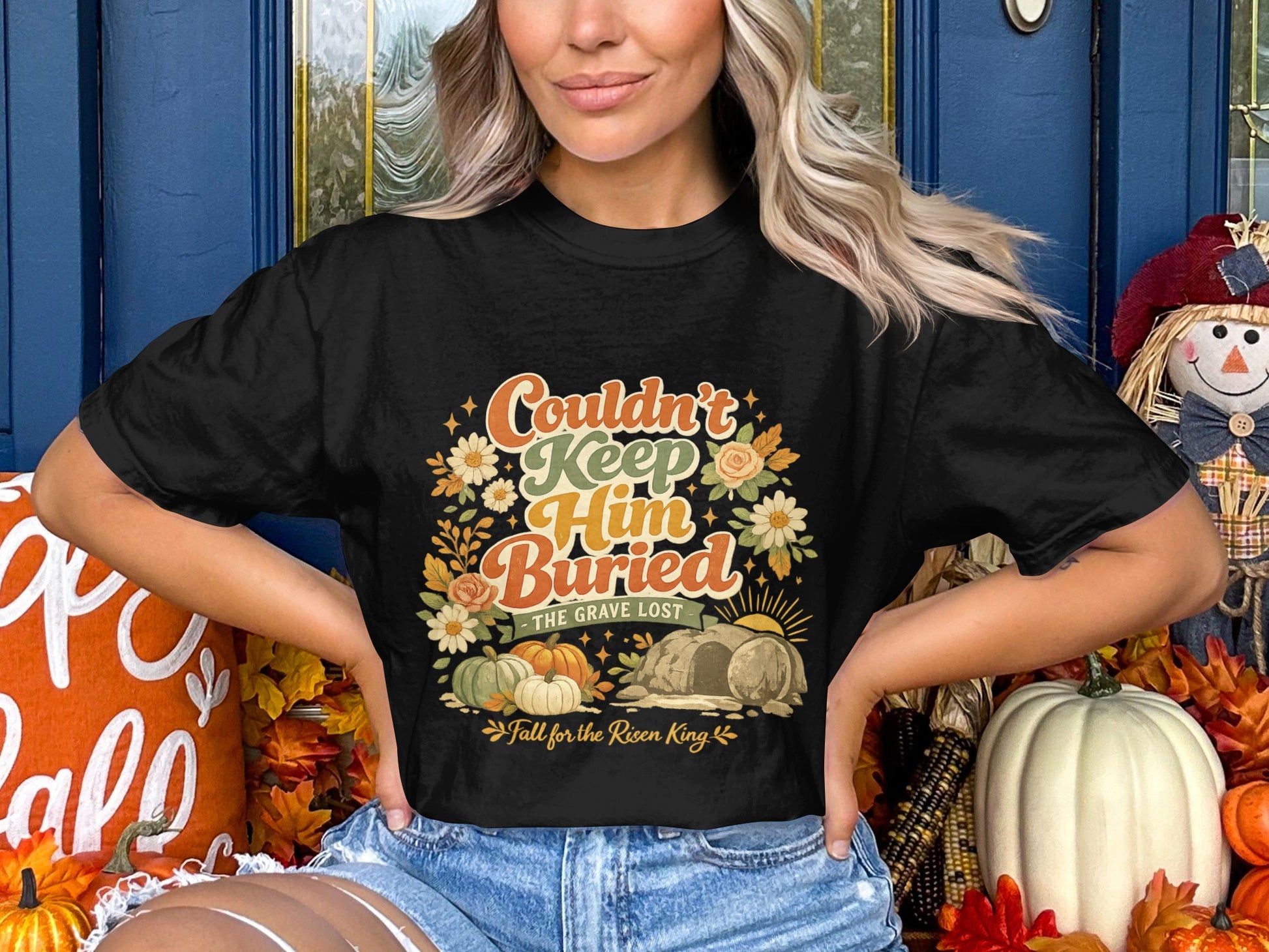 Black t-shirt with "Couldn't Keep Him Buried" and "Fall for the Risen King" text.