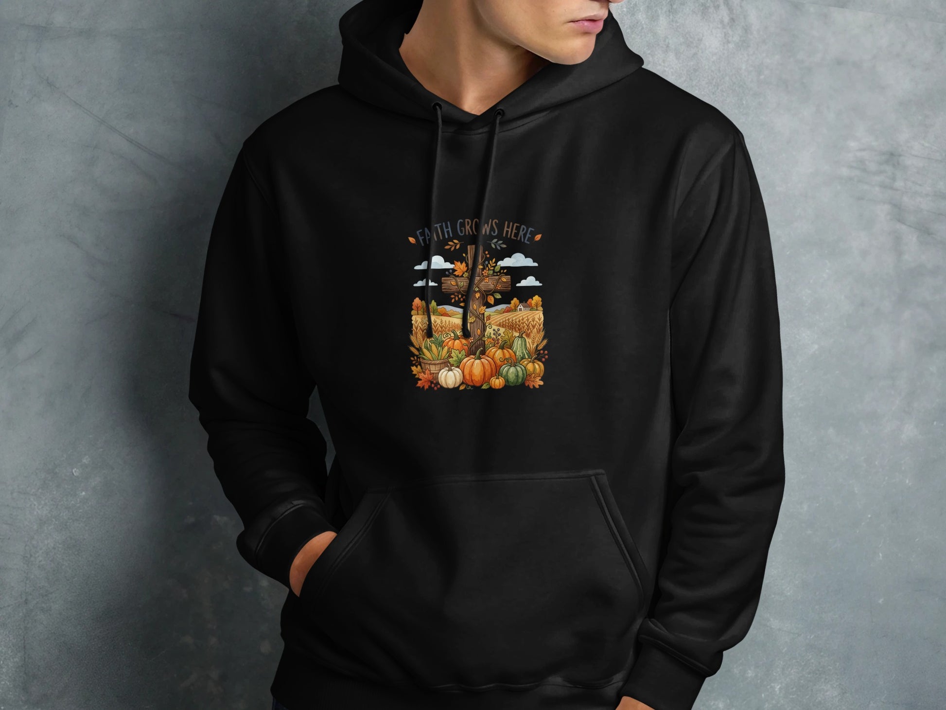 Black hoodie with "Faith Grows Here" text and a fall harvest scene.