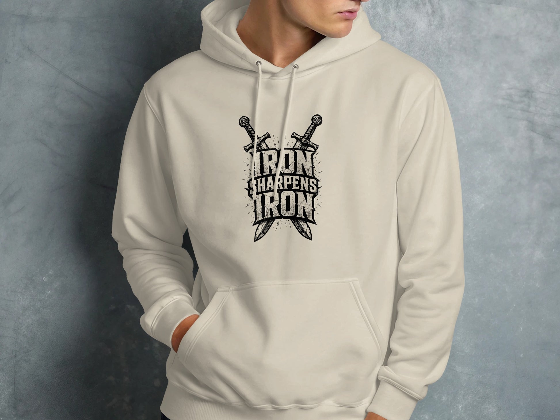 Cream hoodie with crossed swords and text "IRON SHARPENS IRON".