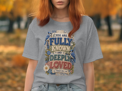 Grey t-shirt with "You are fully known and deeply loved" scripture design.
