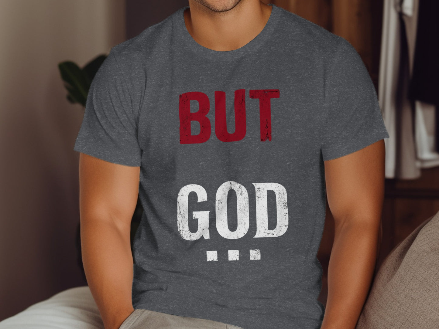 Dark grey t-shirt with red "BUT" and white "GOD" text.