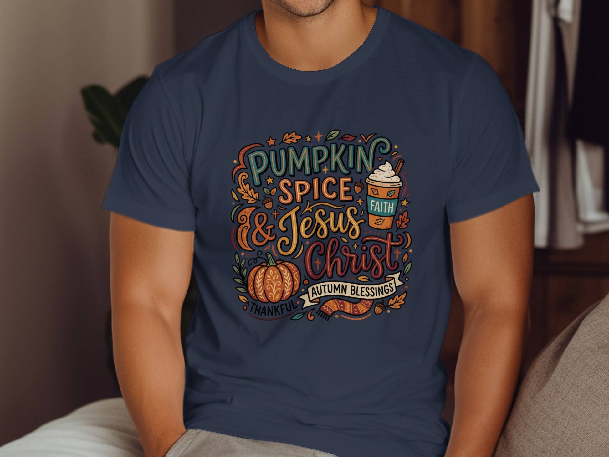 Navy t-shirt with "Pumpkin Spice & Jesus Christ" text and autumn graphics.