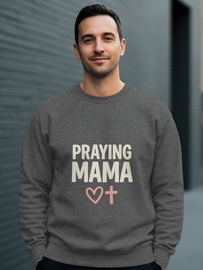 Dark gray sweatshirt with "PRAYING MAMA" text and pink cross with heart.