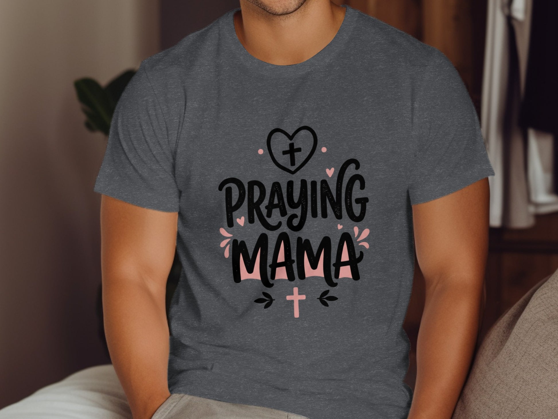 Dark gray t-shirt with "Praying Mama" text and cross graphics.