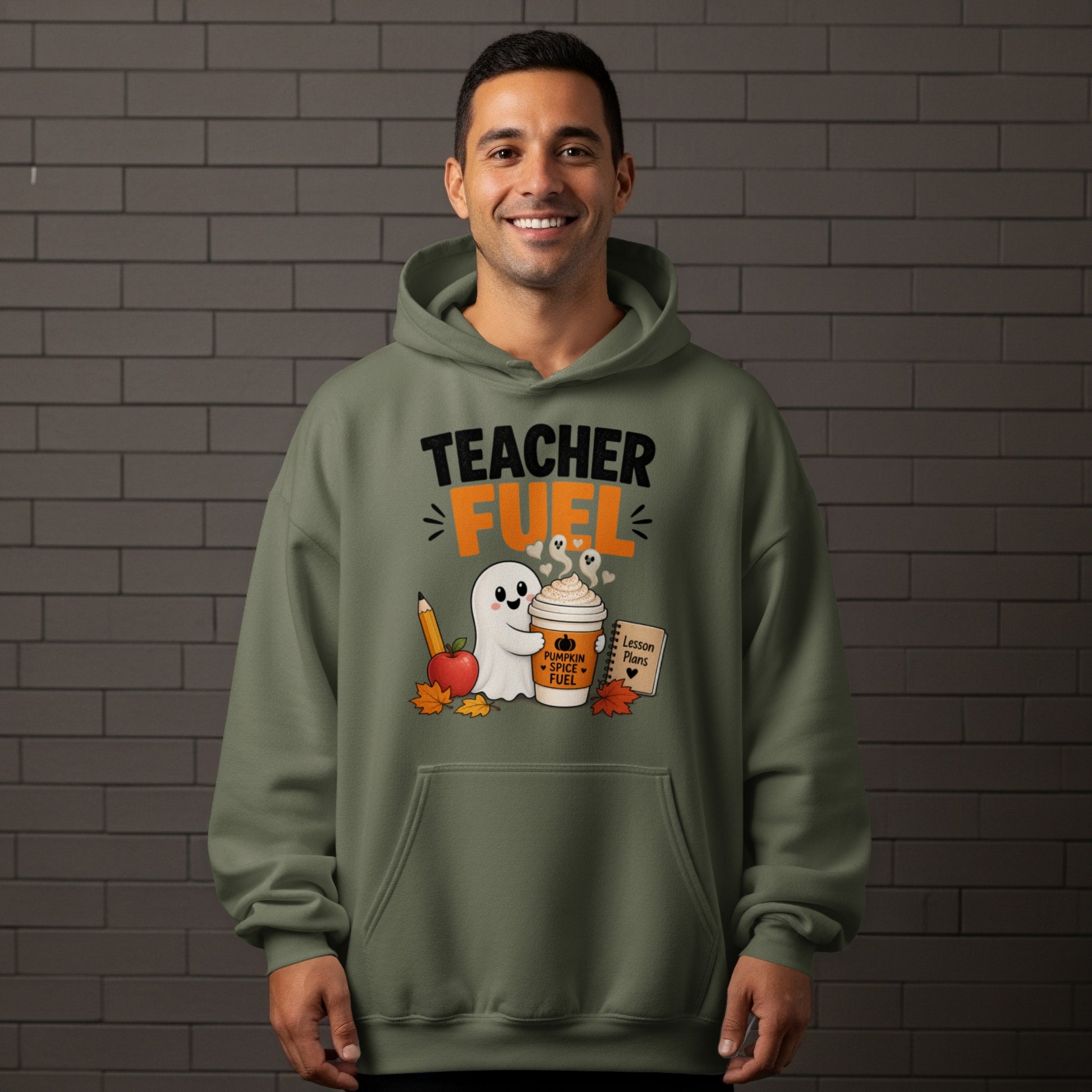 "Teacher Fuel" text on olive hoodie with ghost, coffee, apple, and autumn leaves.