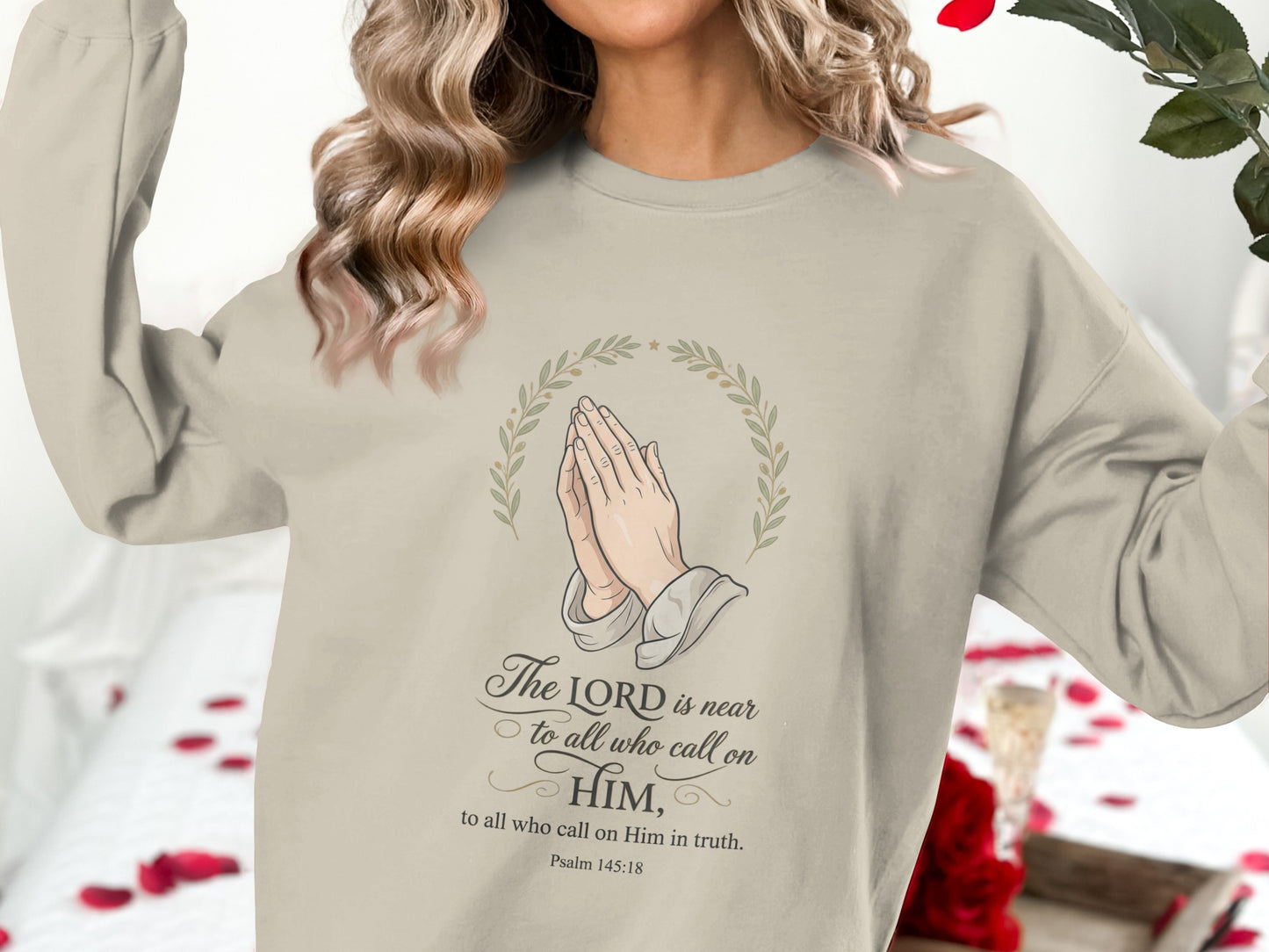 Cream sweatshirt with praying hands and Psalm 145:18 text.