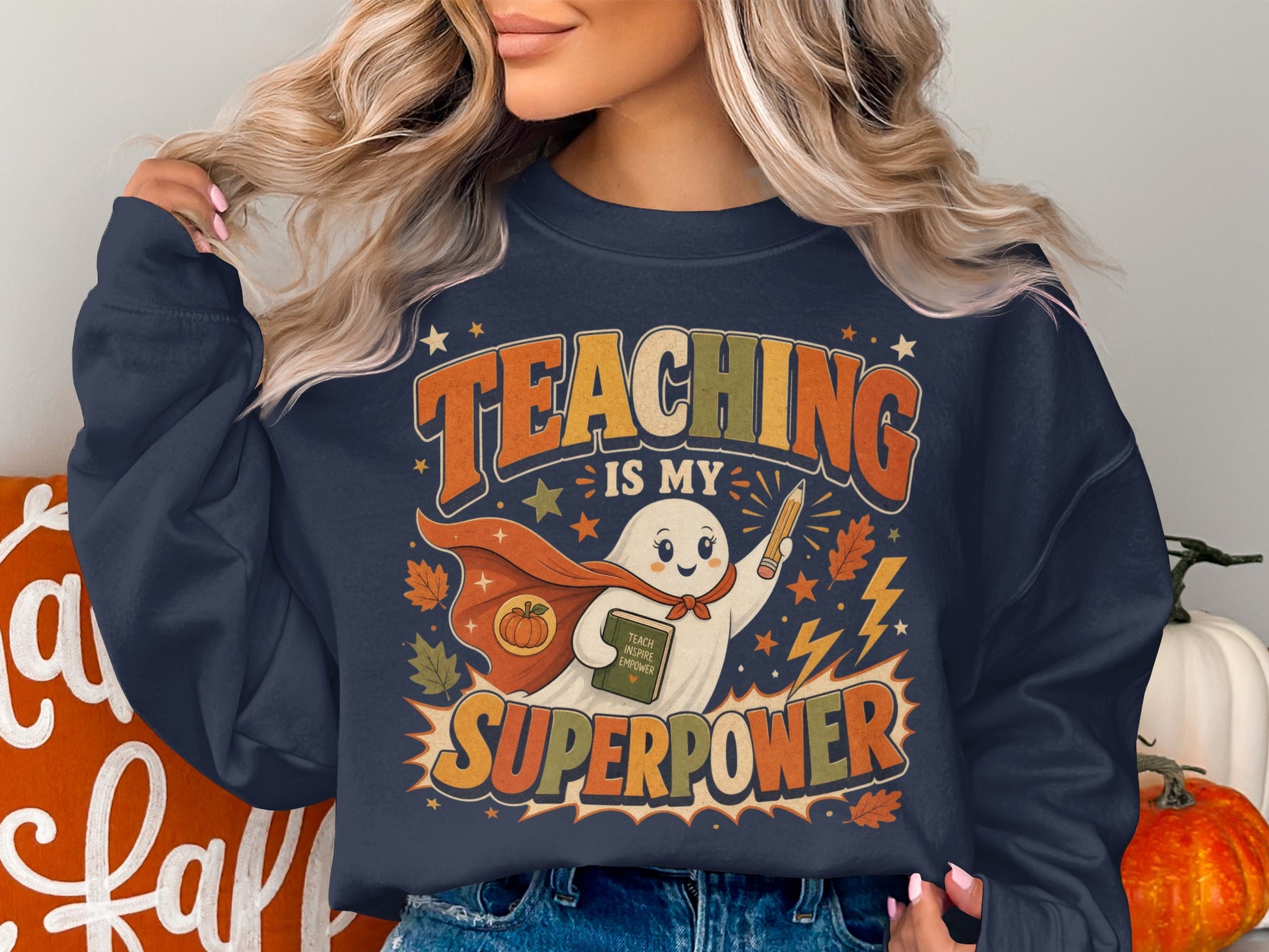 Dark blue sweatshirt with "Teaching Is My Superpower" graphic featuring a ghost superhero.