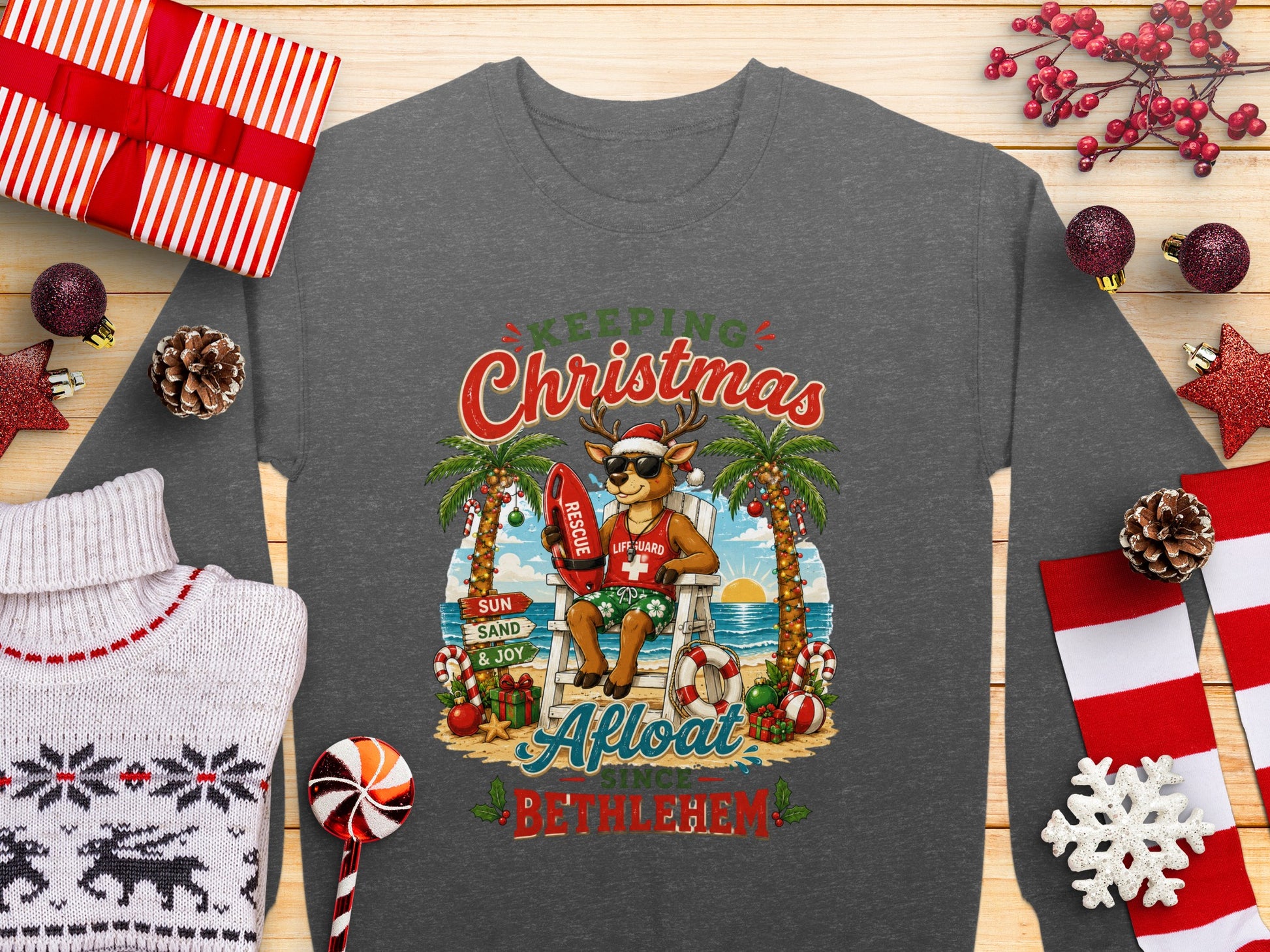 Santa reindeer in lifeguard chair, "Keeping Afloat Since Bethlehem" text, holiday backdrop.