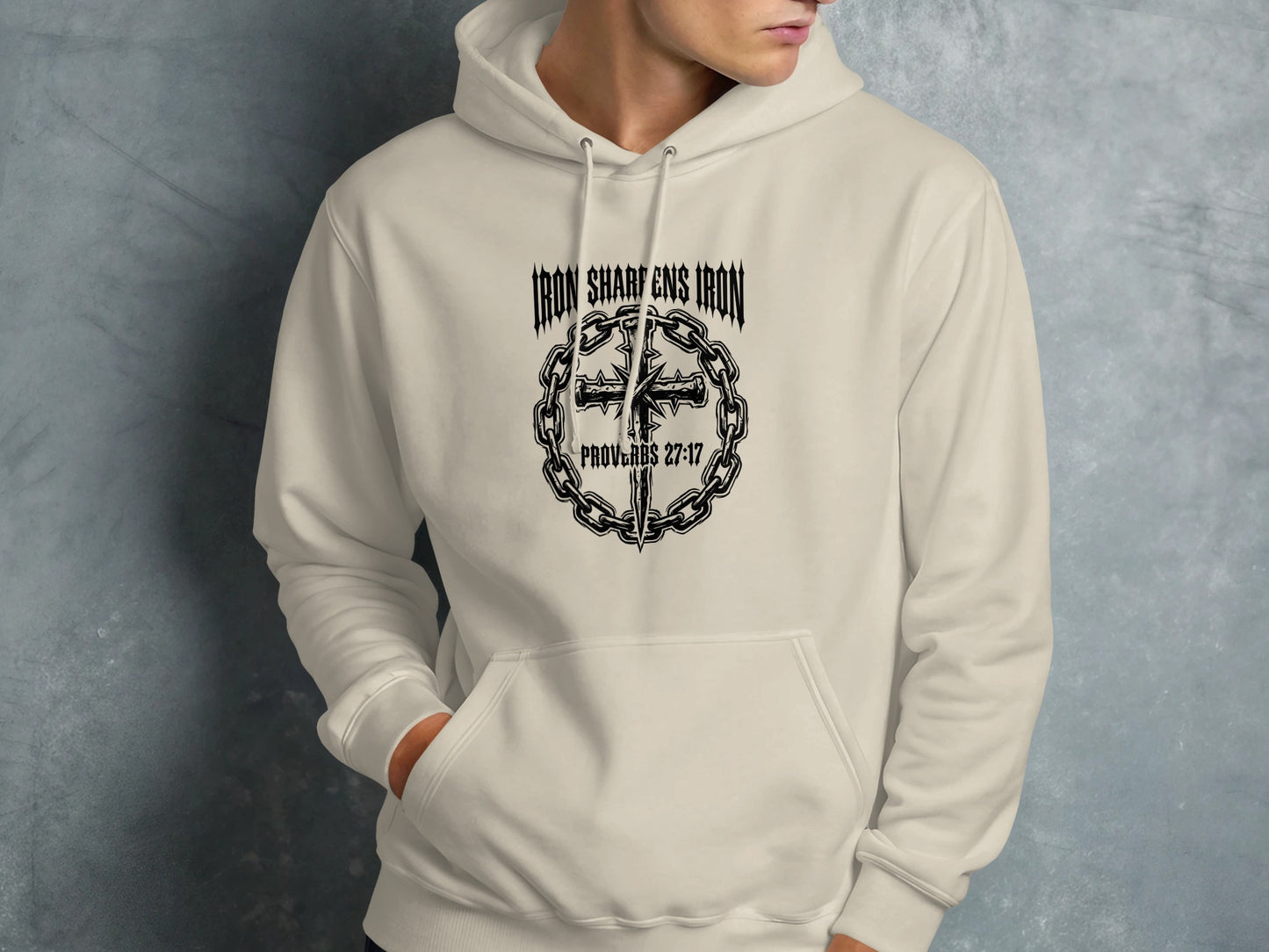 Cream hoodie with "Iron Sharpens Iron" and Proverbs 27:17 text.