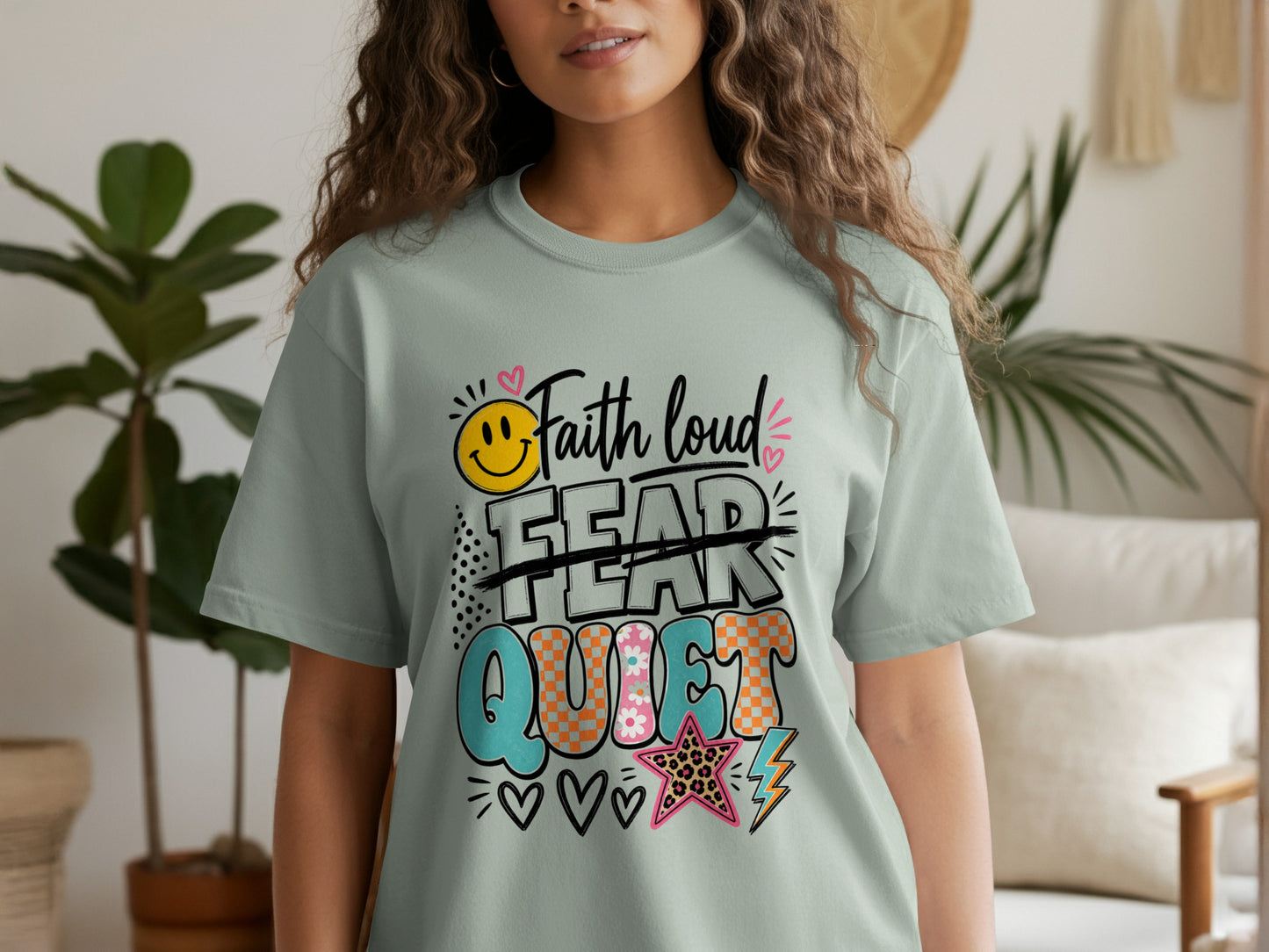 Light green t-shirt with "Faith loud" and "FEAR" crossed out, with "QUIET" below.