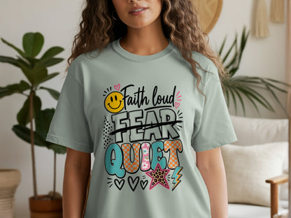 Light green t-shirt with "Faith loud" and "FEAR" crossed out, with "QUIET" below.
