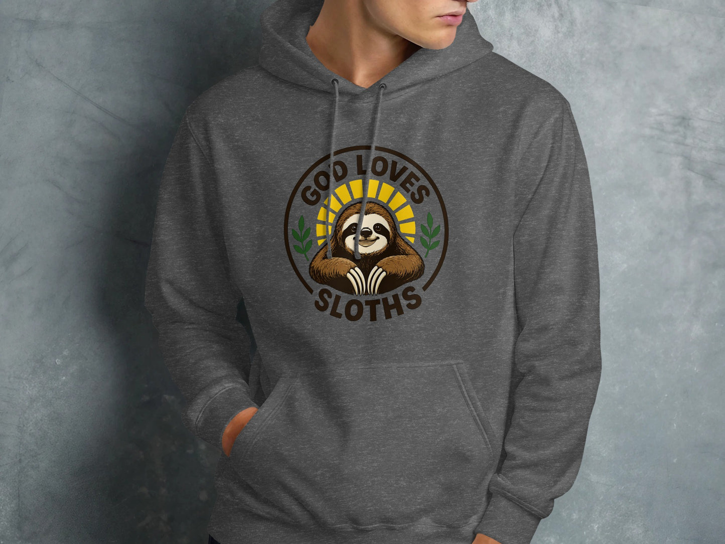 Grey hoodie featuring a circular logo with a smiling sloth and text "God Loves Sloths".