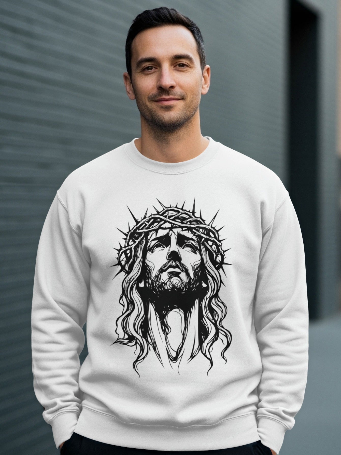 White sweatshirt with a black graphic of Jesus wearing a crown of thorns.