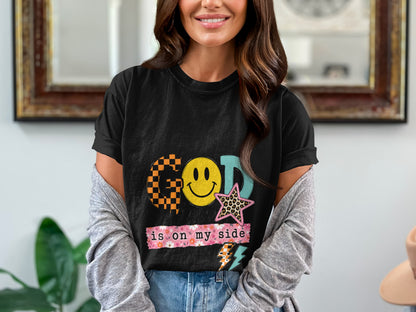 T-shirt with "GOD is on my side" text, smiley face, and stars.