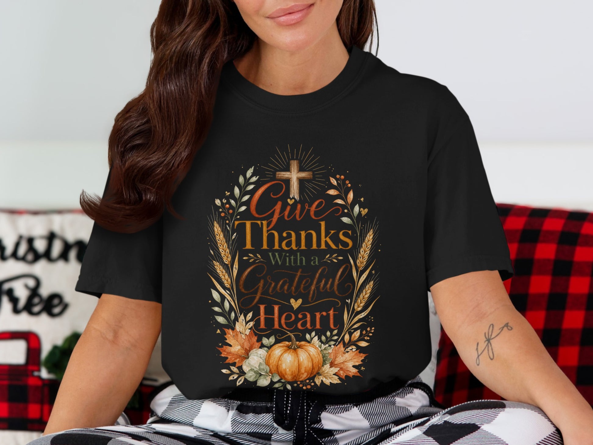 Black t-shirt with "Give Thanks With a Grateful Heart" in decorative text and fall motifs.