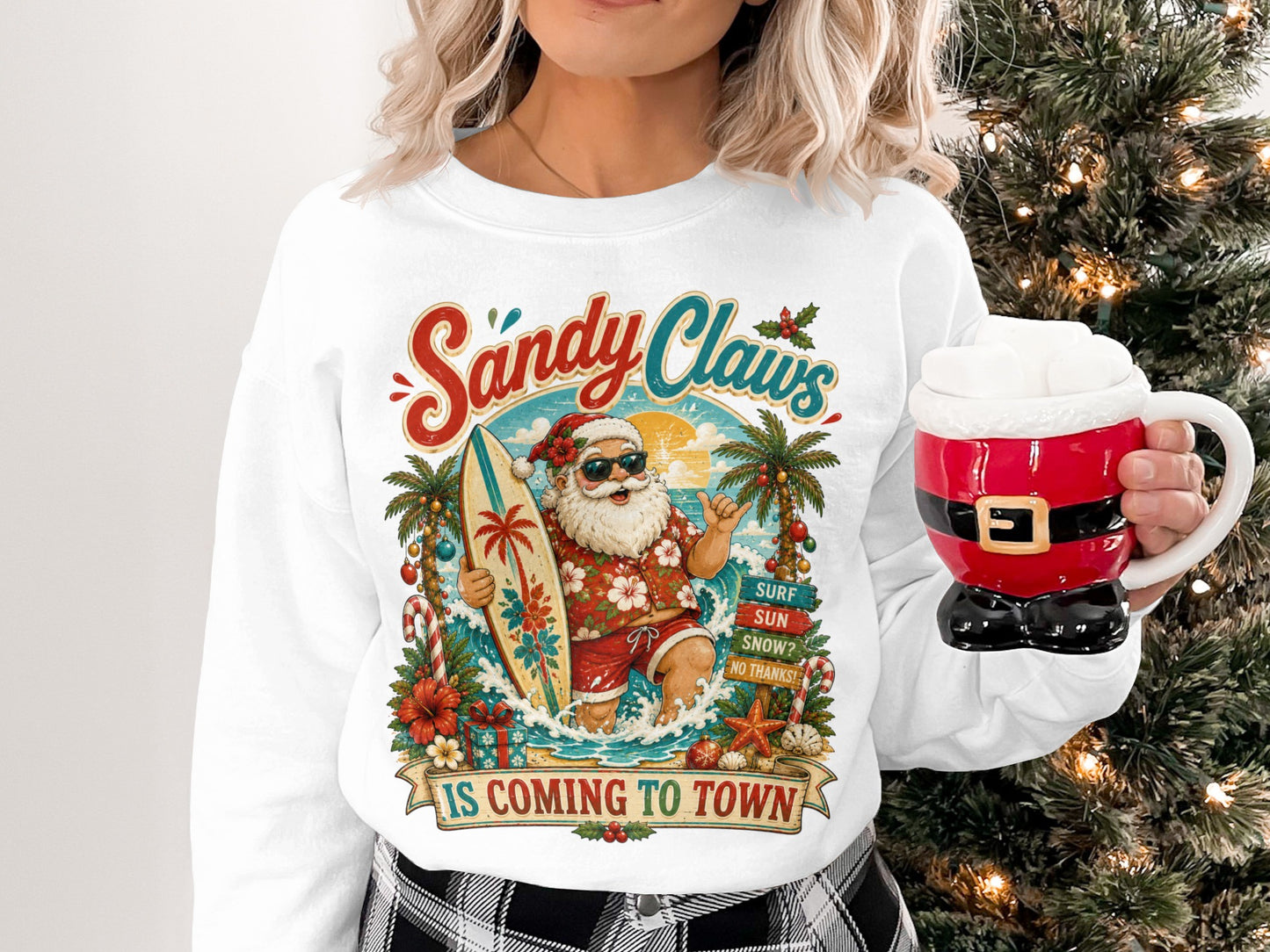 Crewneck sweatshirt with surfing Santa, palm trees, and "Sandy Claws is Coming to Town" text.