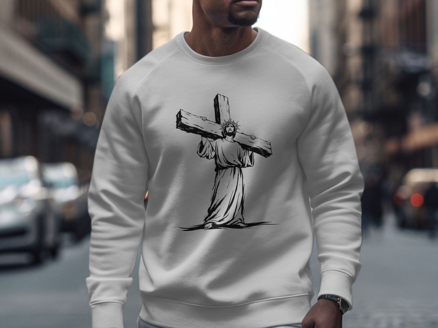 White sweatshirt with graphic of Jesus carrying the cross.