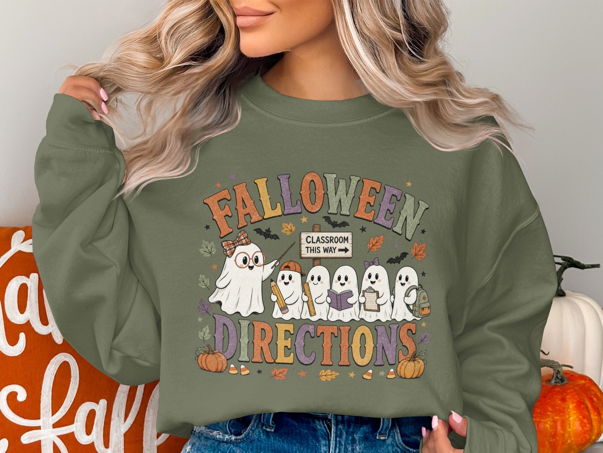 "Falloween Directions" text with ghosts holding school supplies, classroom sign, pumpkins, and candy corn.