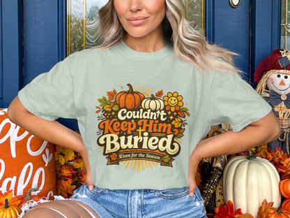 Light green t-shirt with text "Couldn't Keep Him Buried Risen for the Season".