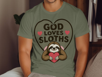 Green t-shirt with "God Loves Sloths" text and a sloth holding a heart.
