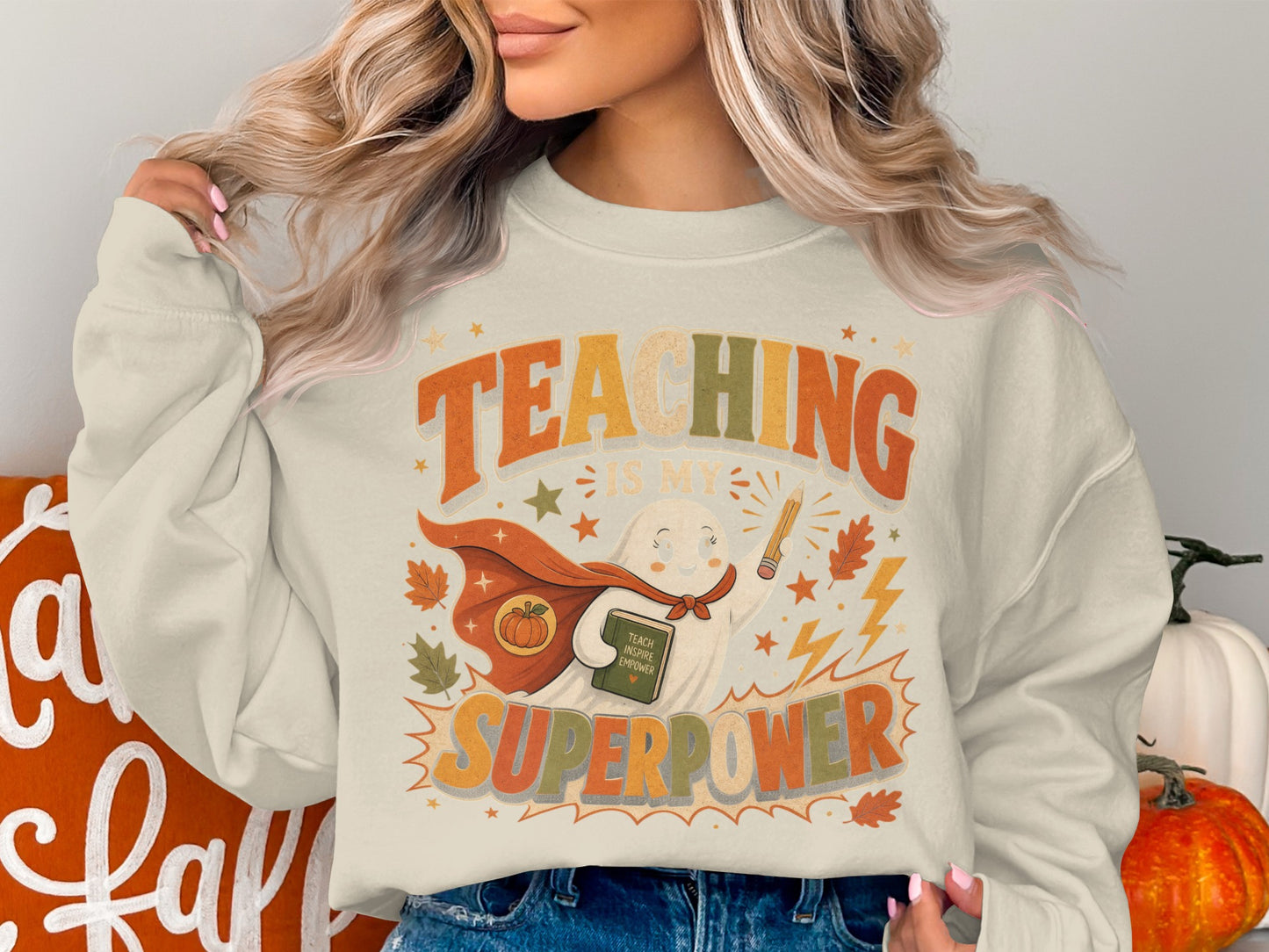 Sweatshirt with text "Teaching is my superpower" and ghost graphic.