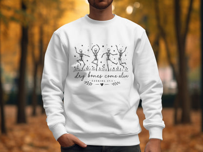 White sweatshirt with dancing skeletons and "Dry bones come alive" text.