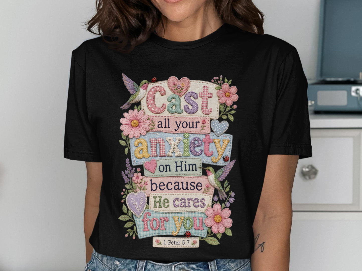 Black t-shirt with "Cast all your anxiety on Him because He cares for you 1 Peter 5:7" text.