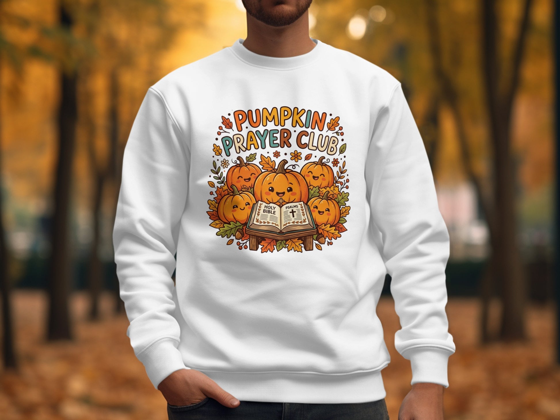 White sweatshirt with "Pumpkin Prayer Club" logo featuring smiling pumpkins and a Bible.
