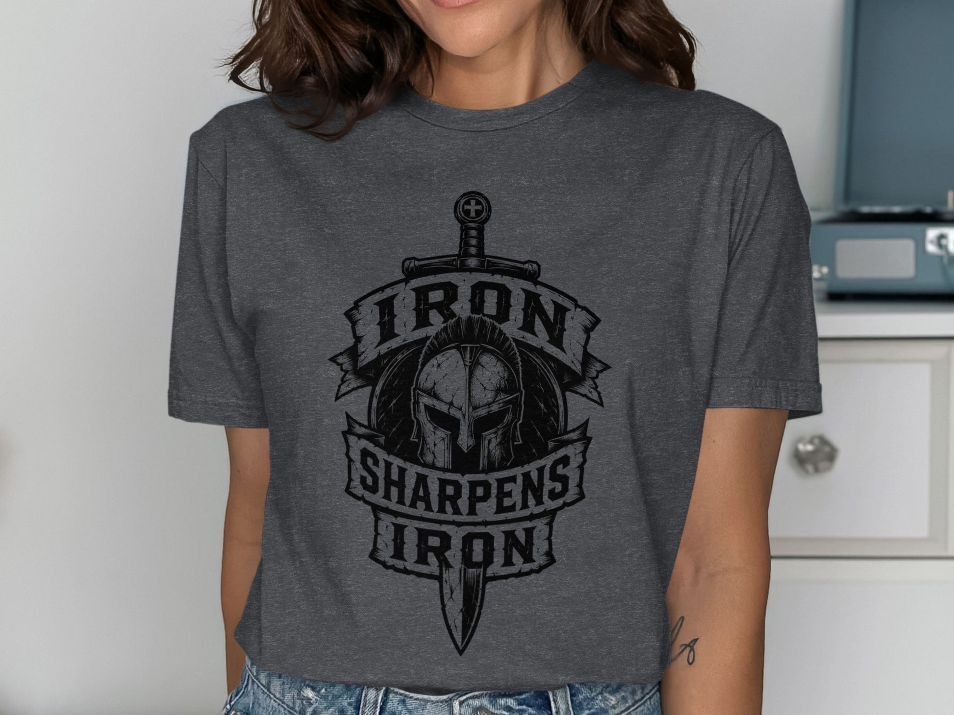 Dark gray t-shirt featuring a graphic of a Spartan helmet and crossed swords with text.