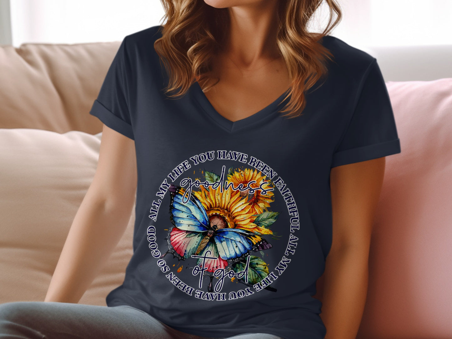 Butterfly and sunflowers on a navy blue v-neck t-shirt with text.