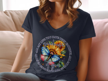 Butterfly and sunflowers on a navy blue v-neck t-shirt with text.