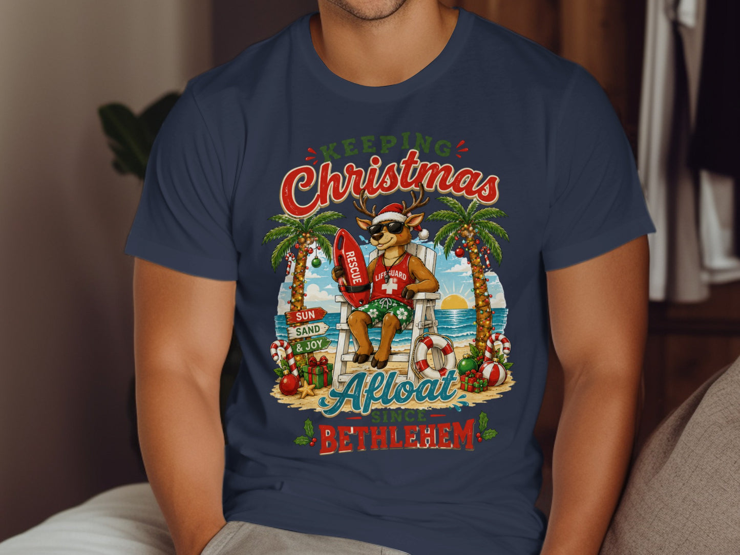 Reindeer lifeguard in Santa hat and sunglasses sitting on beach chair with surfboard.