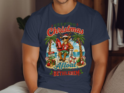 Reindeer lifeguard in Santa hat and sunglasses sitting on beach chair with surfboard.