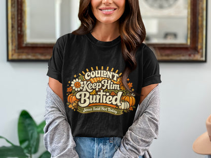 Black t-shirt with "Couldn't Keep Him Buried Jesus Said Not Today" graphic.