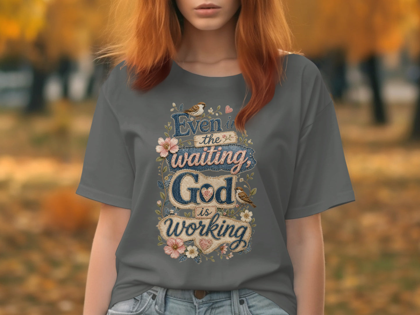Gray t-shirt with "Even in the waiting, God is working" text and floral accents.