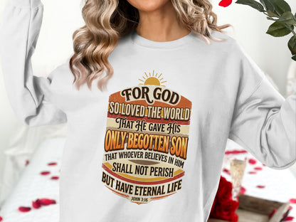 White sweatshirt with "For God So Loved the World John 3:16" scripture.
