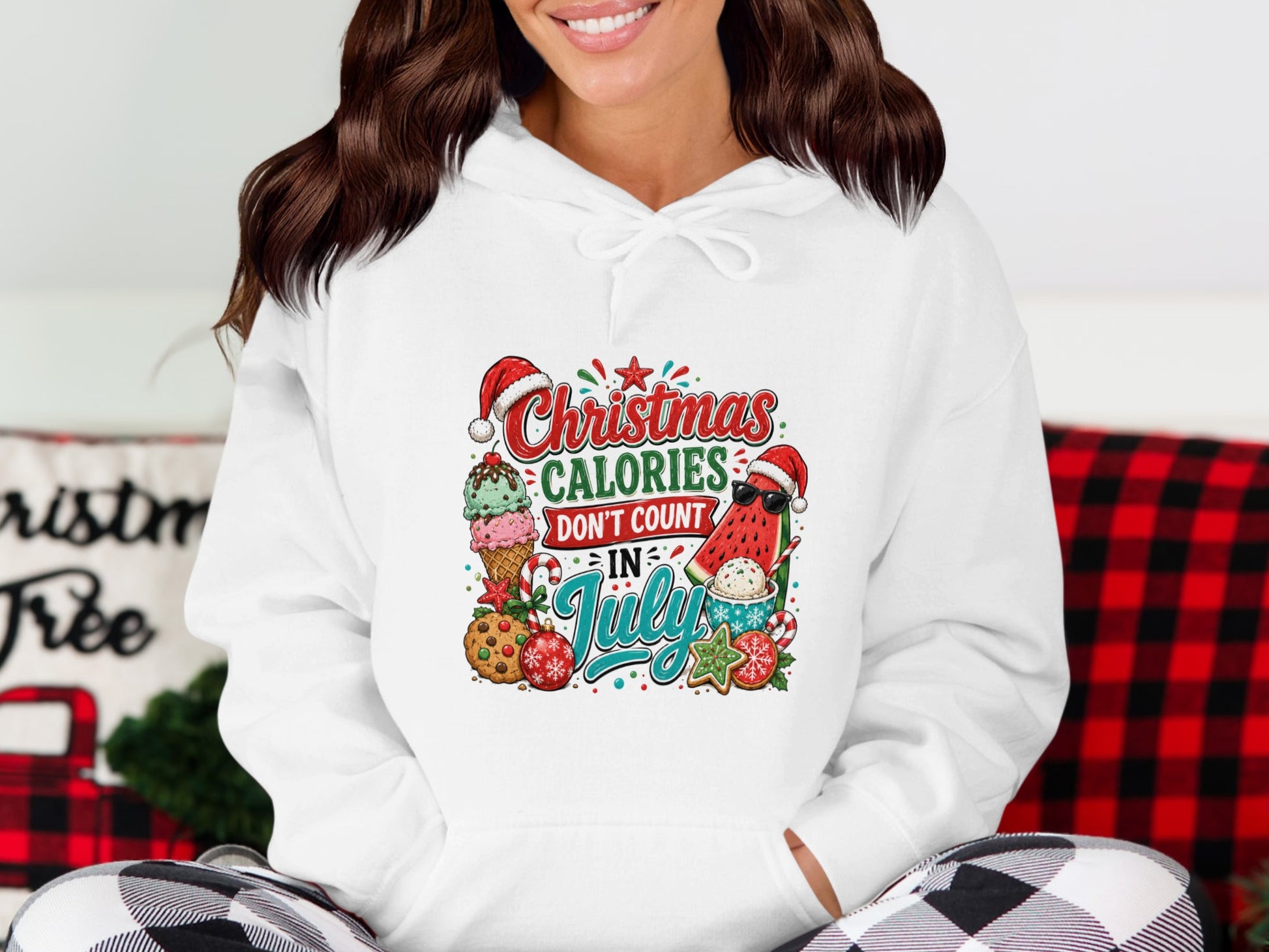 White hoodie with "Christmas in July" design featuring watermelon, ice cream, and cookies.