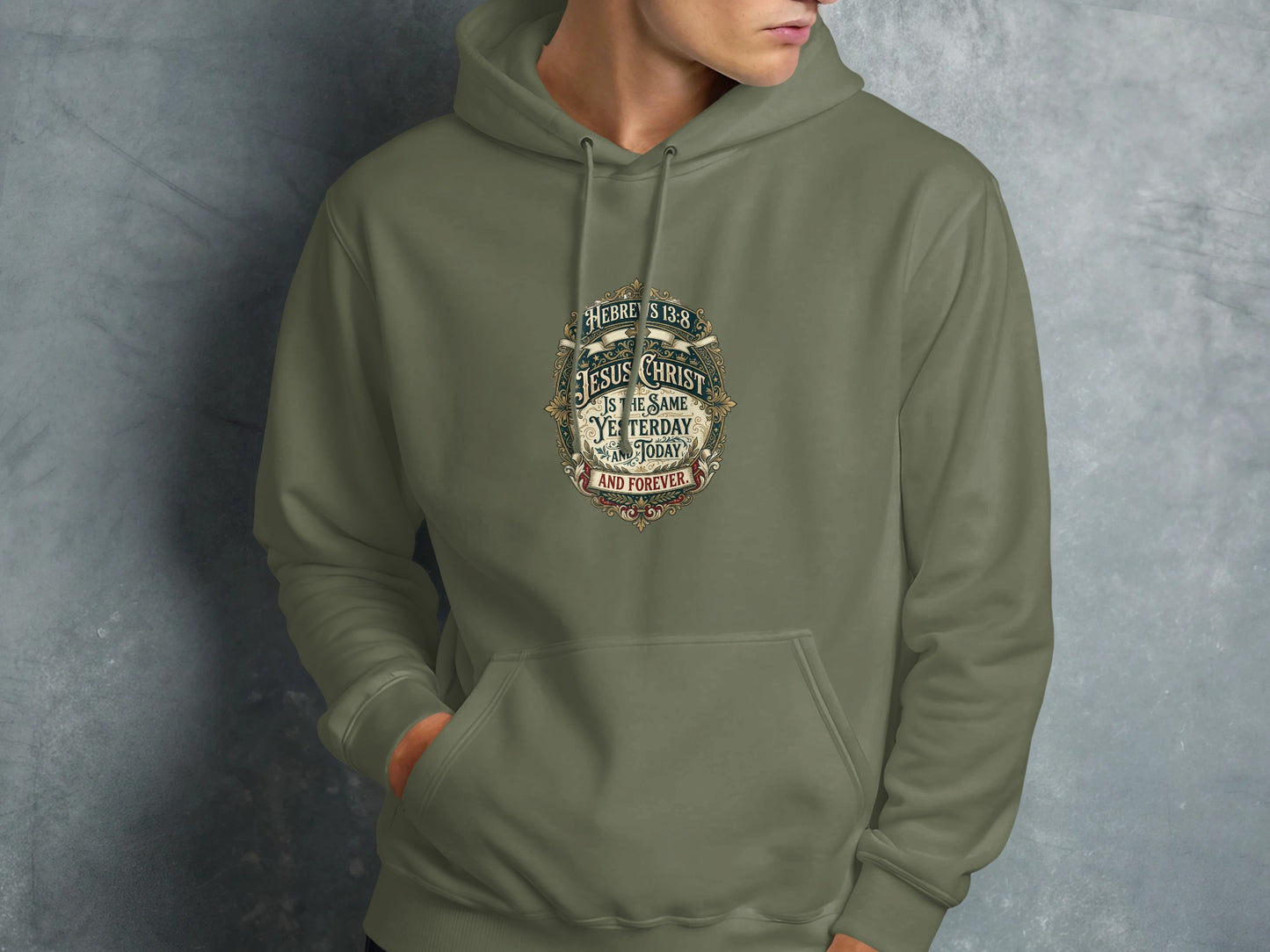 Olive hoodie with Jesus Christ scripture graphic: "HEBREWS 13:8 JESUS CHRIST IS THE SAME YESTERDAY AND TODAY AND FOREVER."