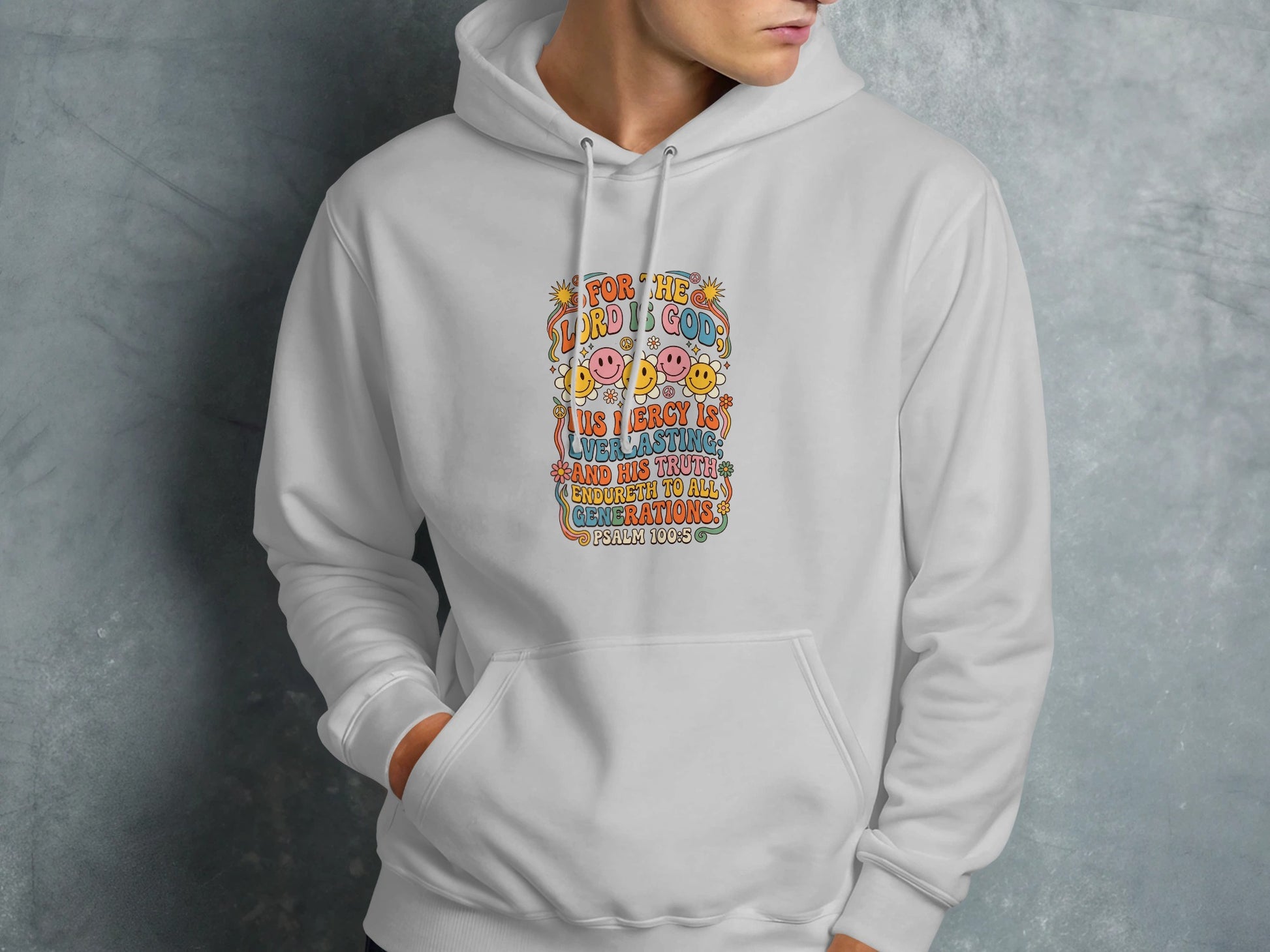 White hoodie with colorful "PSALM 100:5" text and smiley faces.