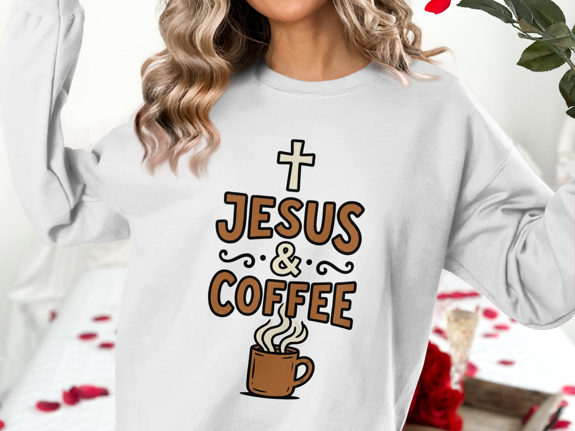 White sweatshirt with "Jesus & Coffee" text and a coffee cup graphic.