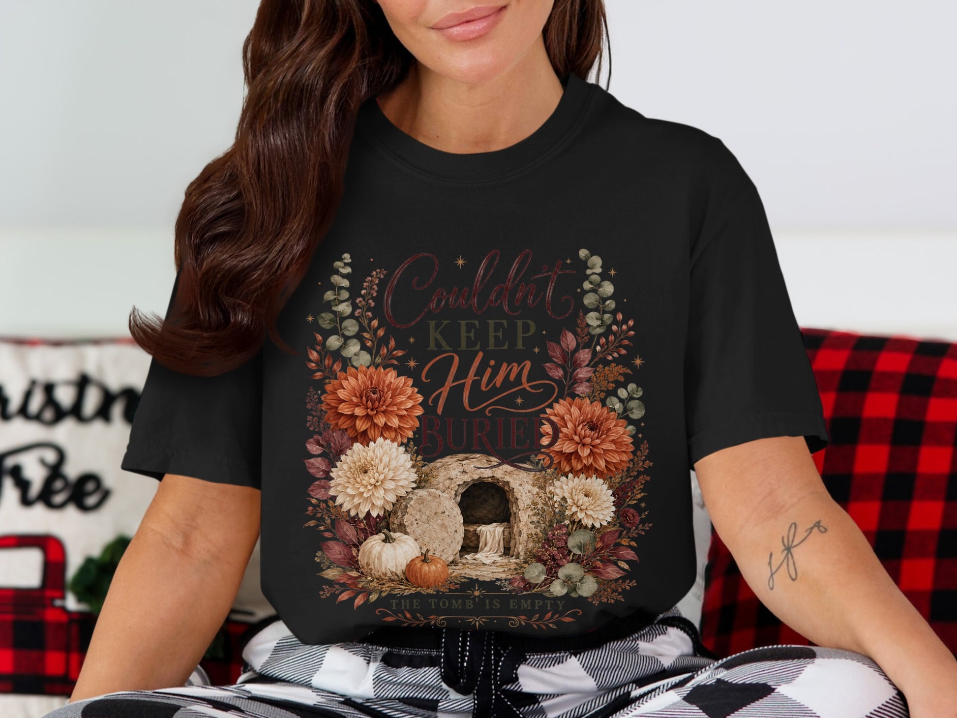 Black t-shirt with floral design, empty tomb, pumpkins, and text.