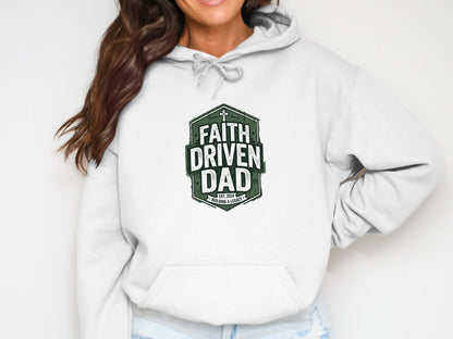 White hoodie with green "Faith Driven Dad" shield logo and established date.