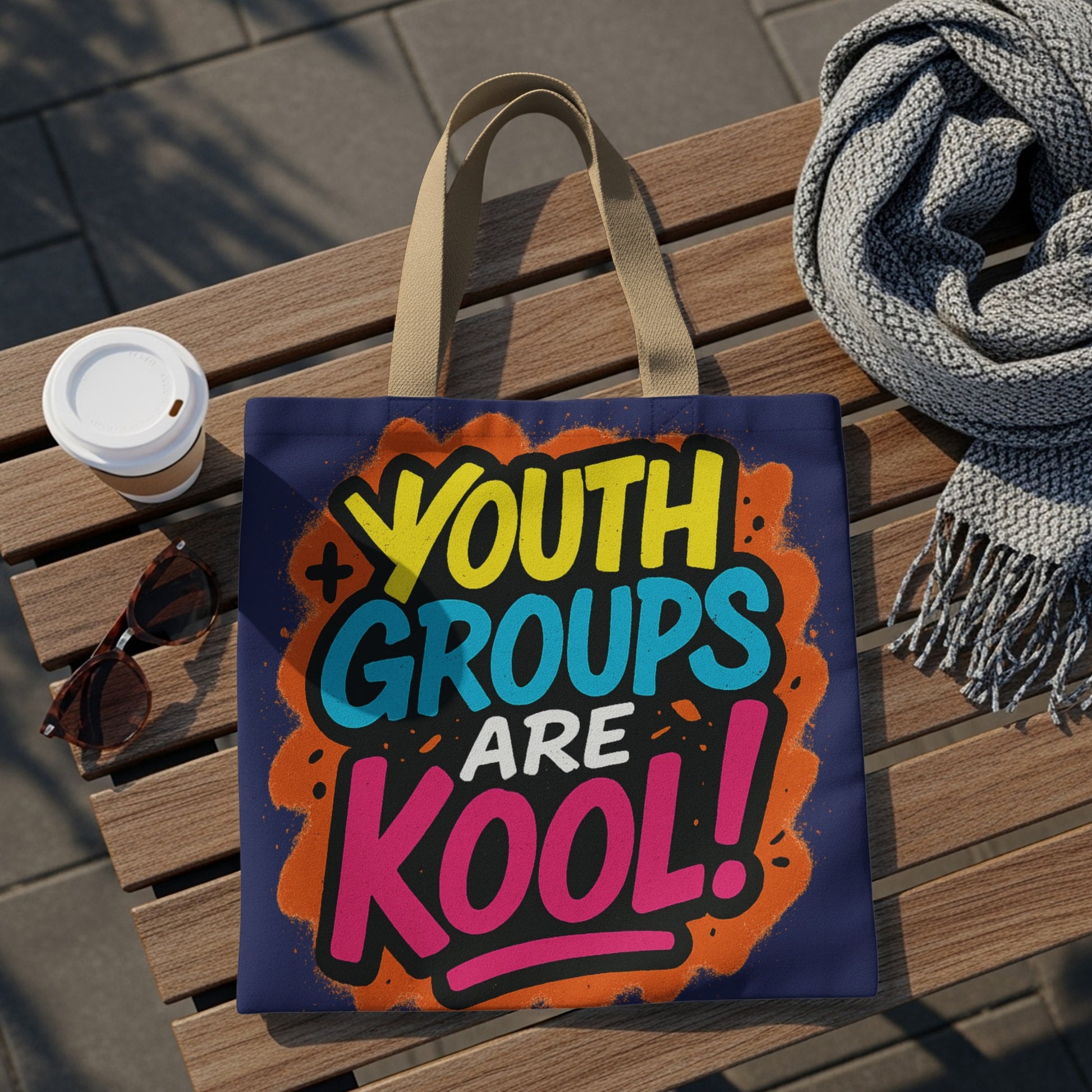 Tote bag with colorful "Youth Groups Are Kool!" graffiti design and tan straps.