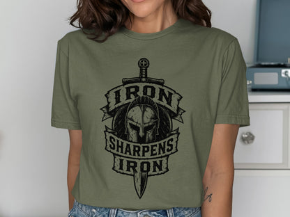 Olive green t-shirt with "Iron Sharpens Iron" and warrior helmet graphic.