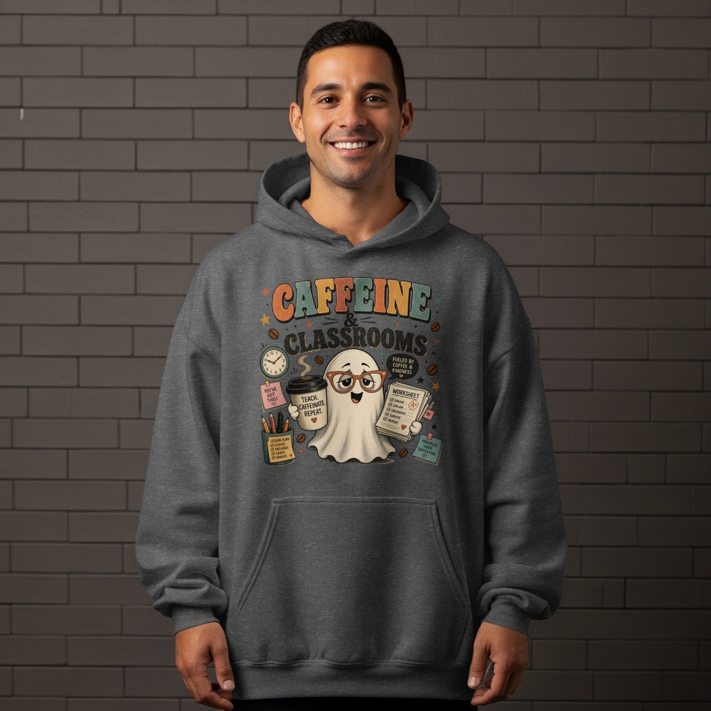 Dark gray hoodie with a graphic of a ghost holding coffee and a worksheet.