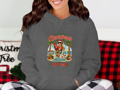 Christmas lifeguard Santa Claus sits on a beach chair with "Aloha Bethlehem" text.