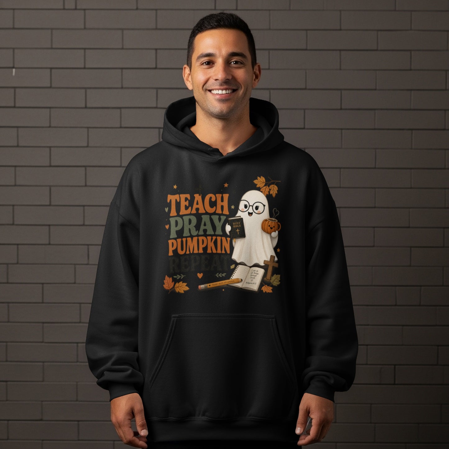 Black hoodie with "Teach Pray Pumpkin Repeat" and ghost with Bible and pumpkin.